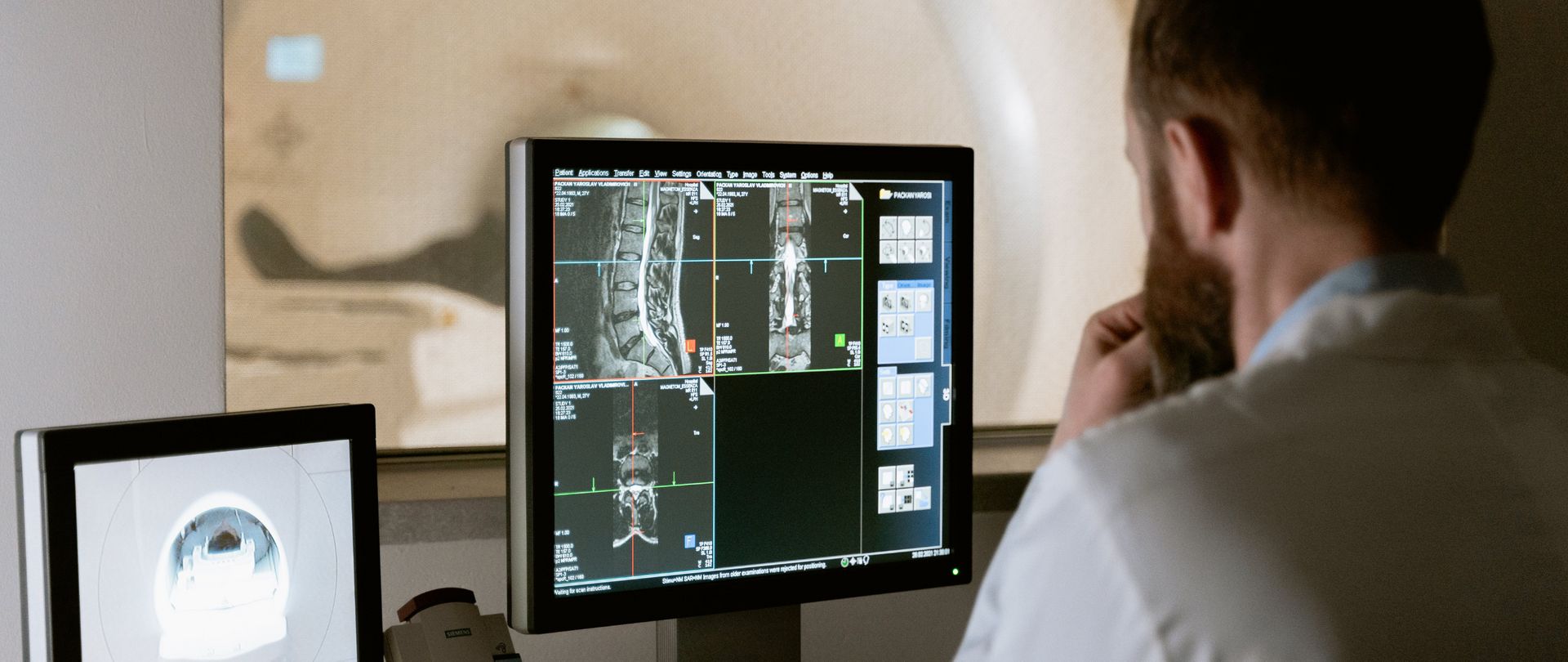 man with CT scanner