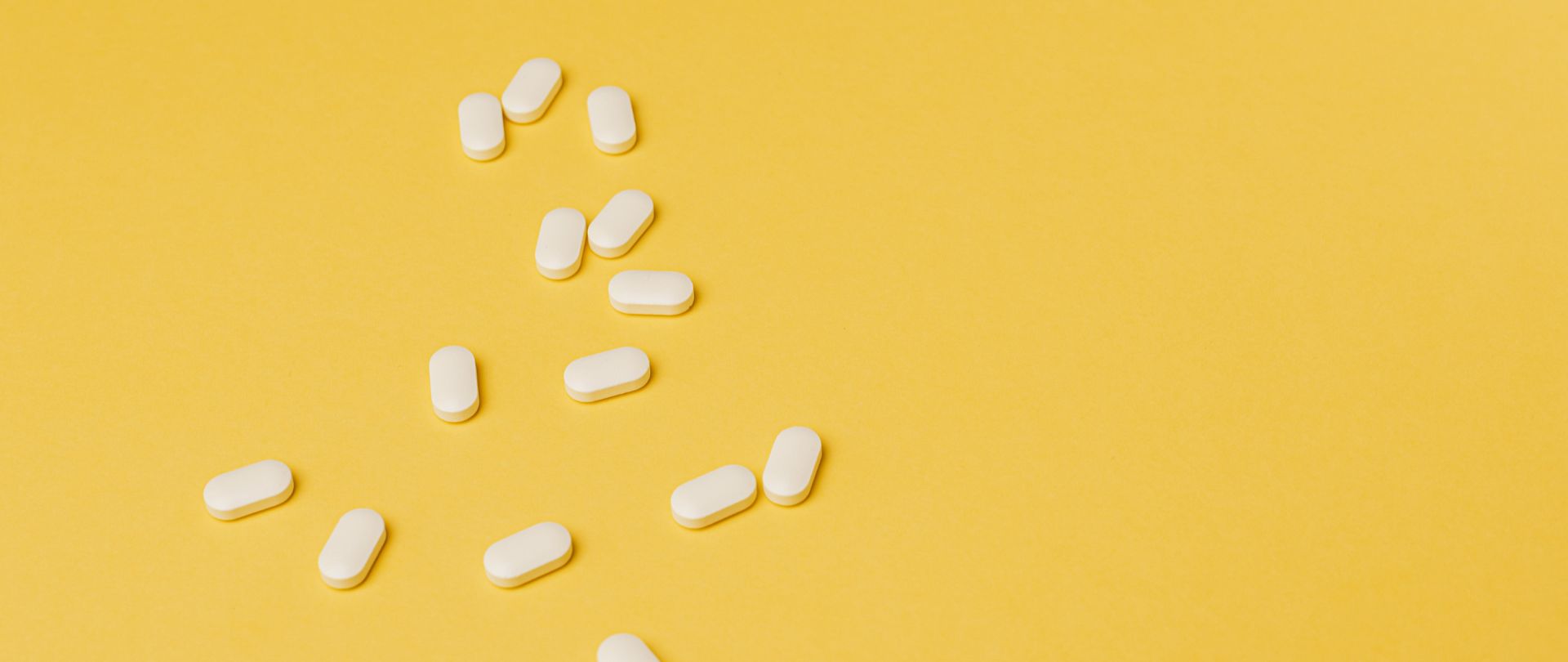 pills on a yellow background