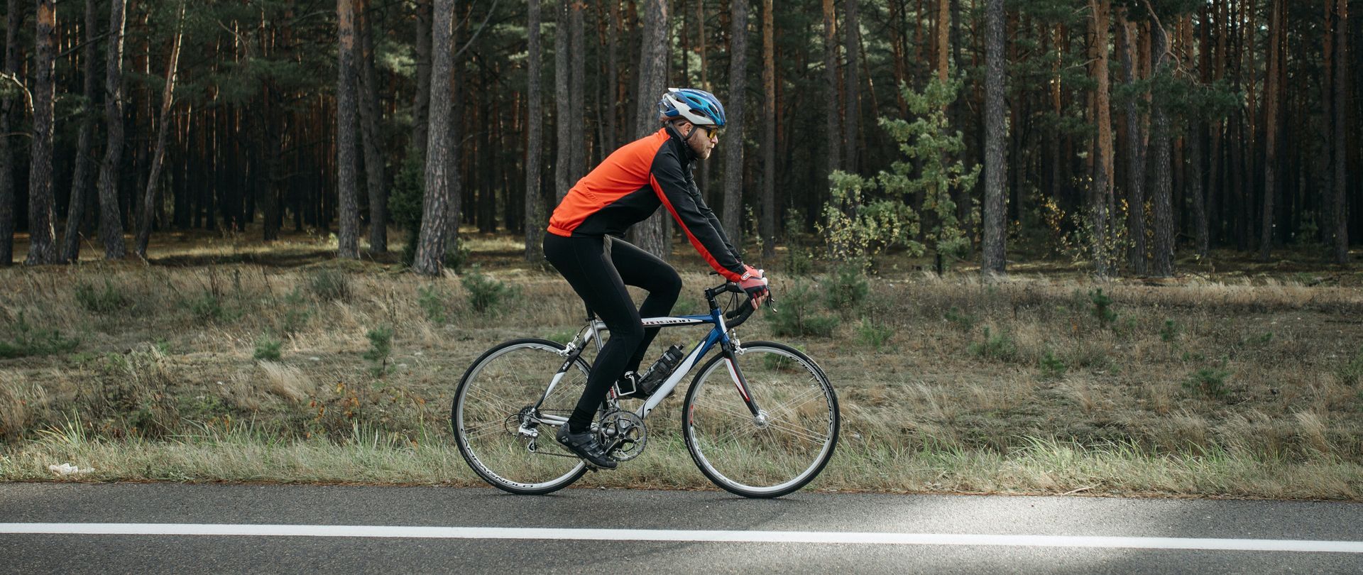 man cycling in forest