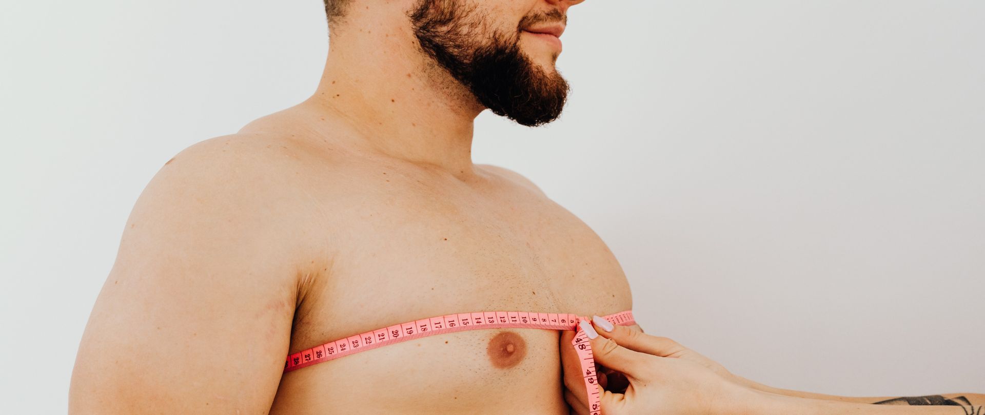 man measuring chest